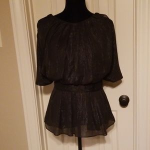 Black lined blouse with silvery sparkle.